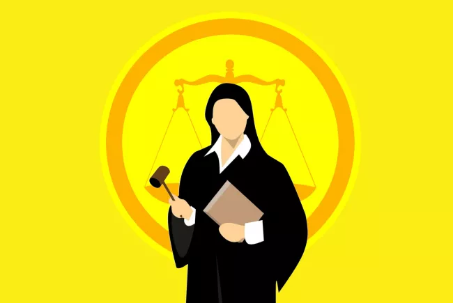 Judge holding book and gavel with scales of justice behind her